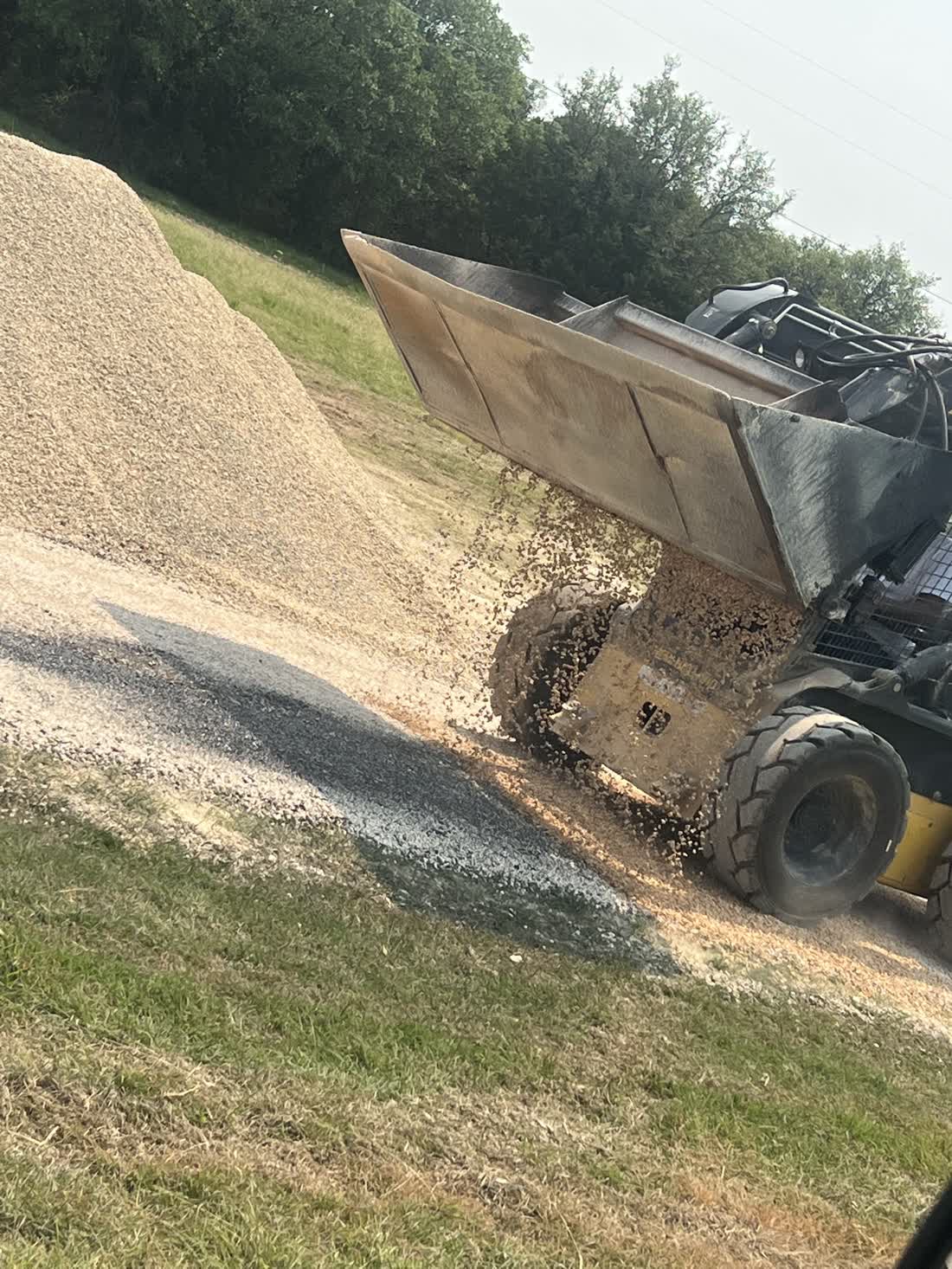 Aggregate stockpile staged for a chip seal job